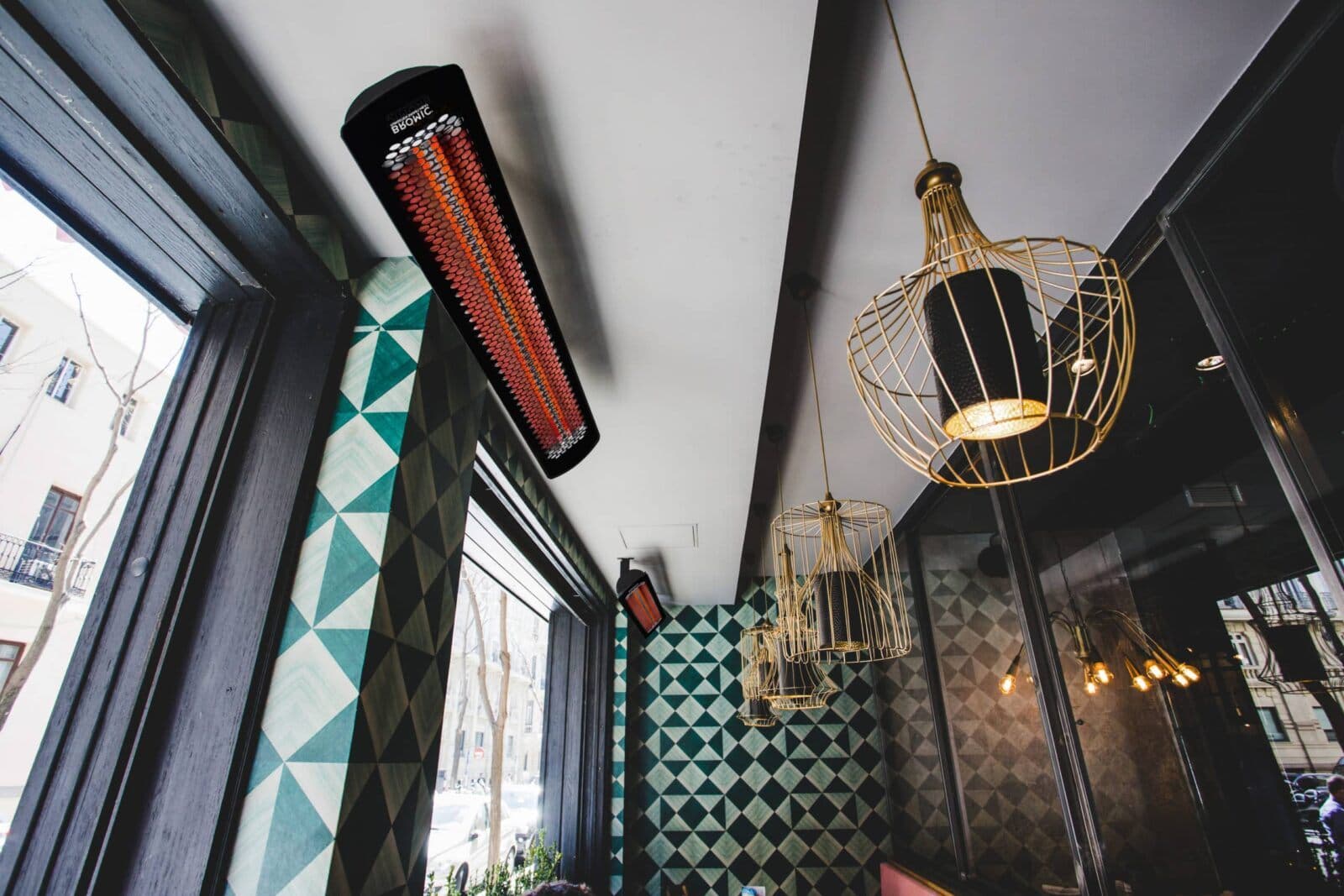Bromic Tungsten Electric heaters mounted over a cafe terrace