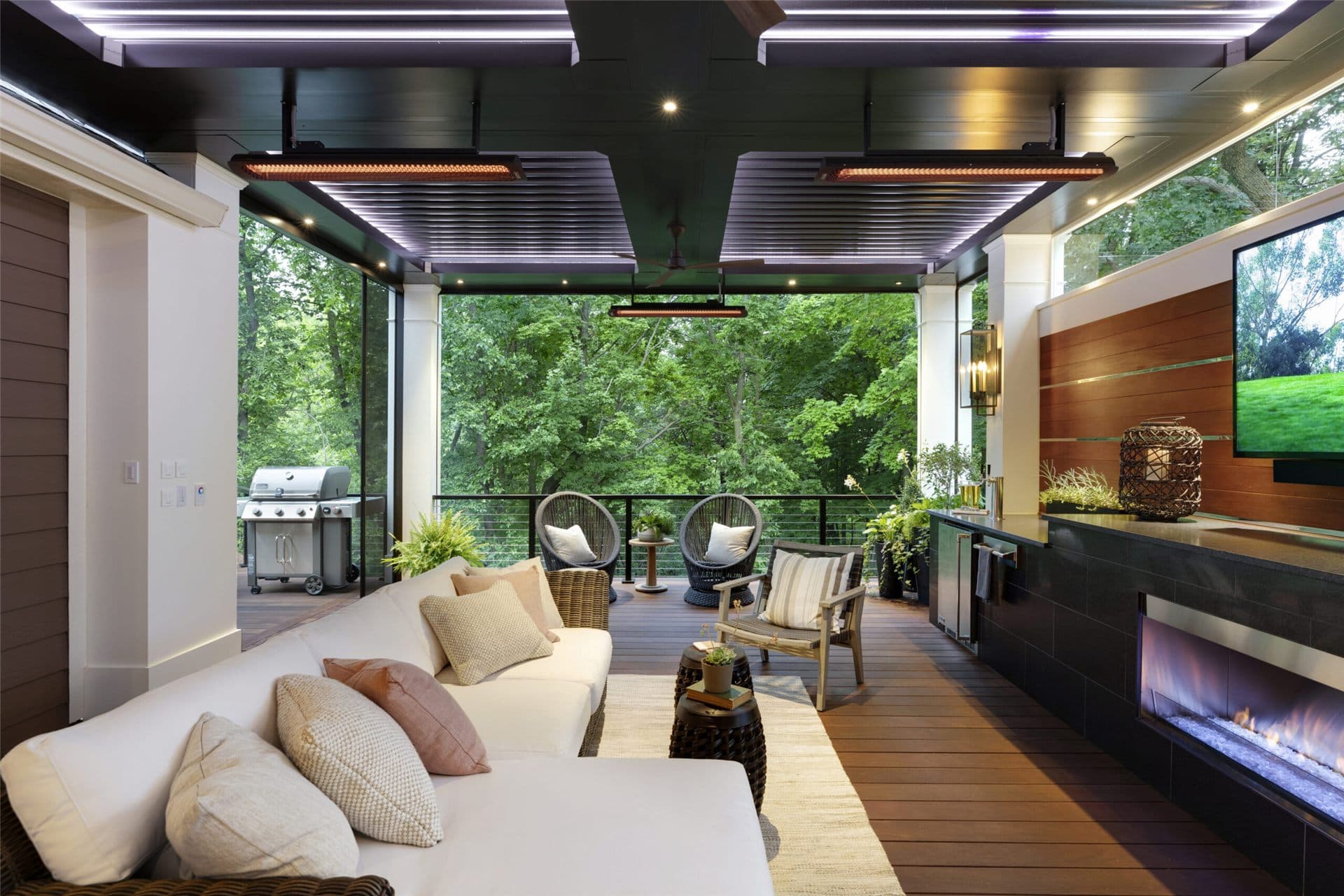 Row of black Bromic Tungsten electric heaters over a restaurant patio