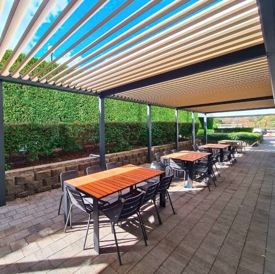 Louvered roof system over a restaurant patio