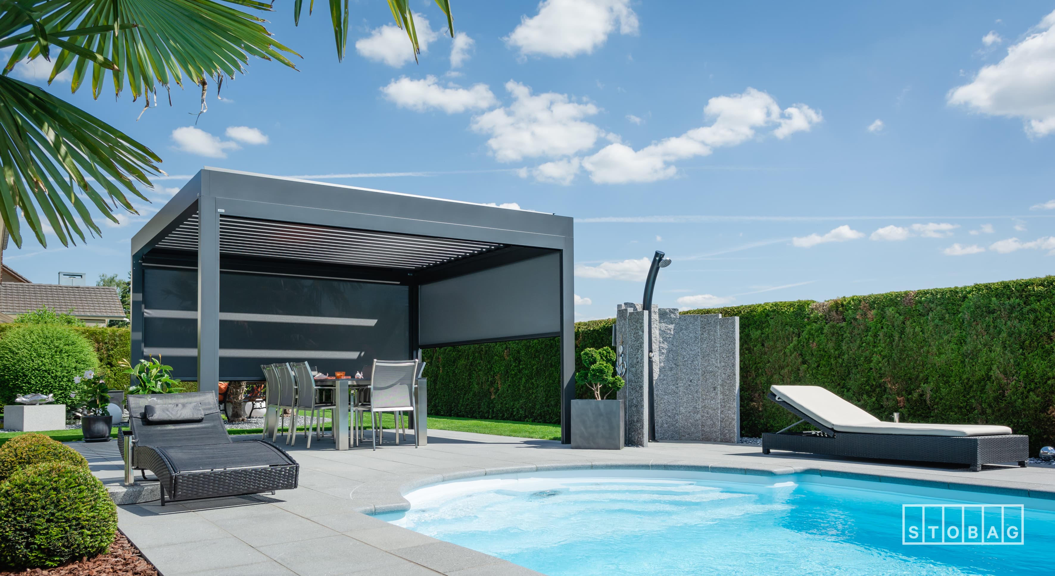 STOBAG BAVONA with side screens lowered beside a pool
