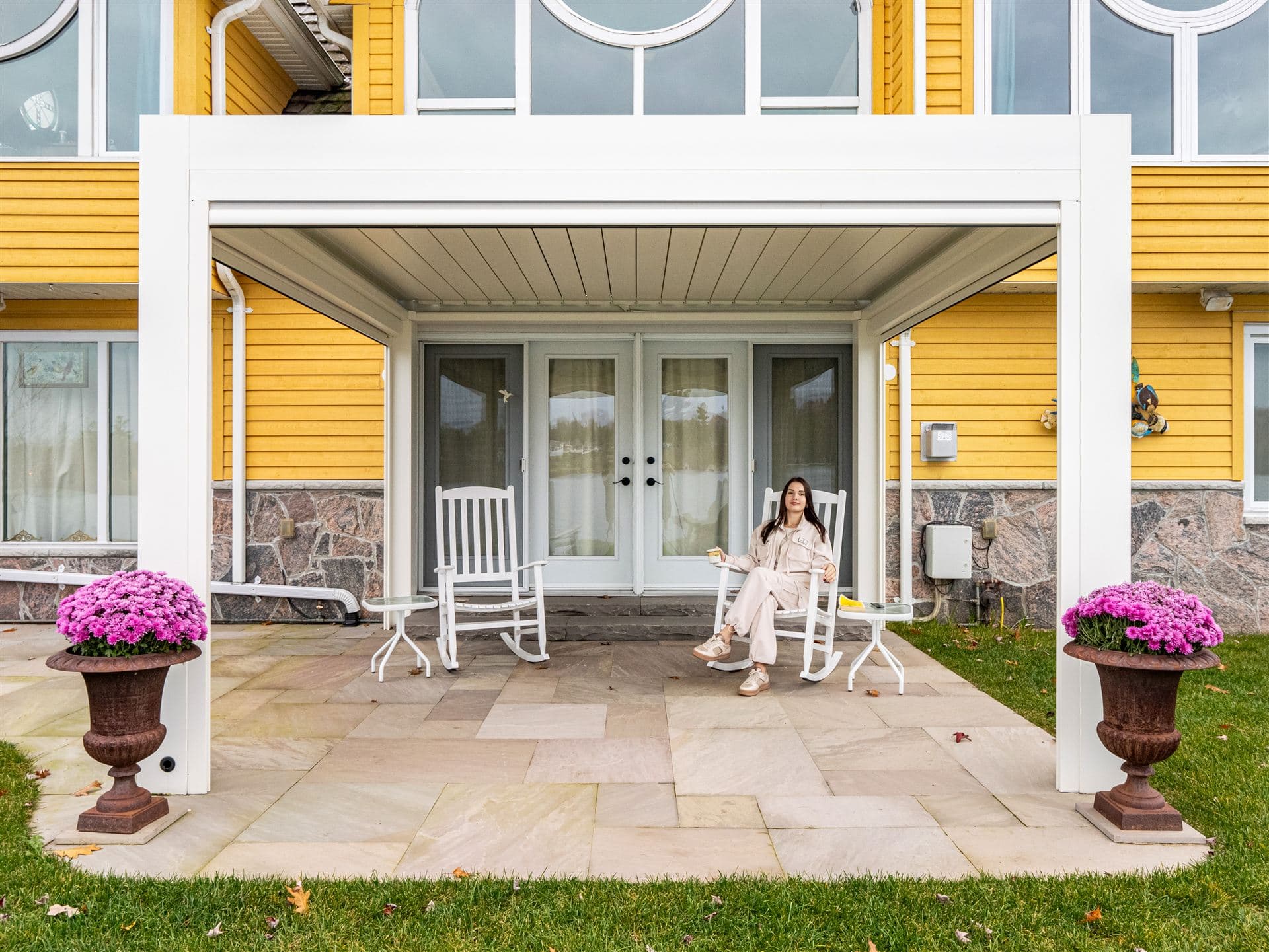 White LOUSOL louvered pergola with zip screens