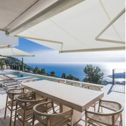 Retractable deck awning extended for afternoon shade