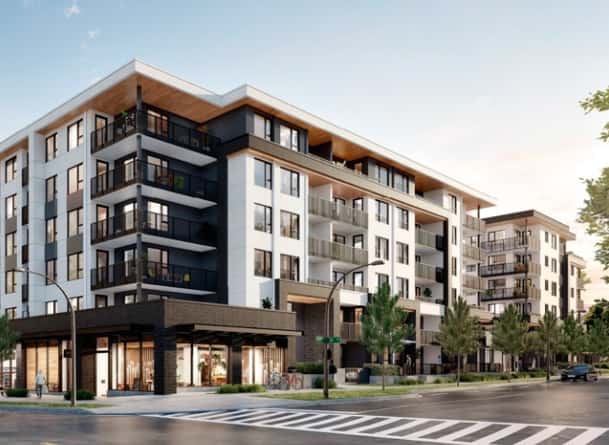 Glass canopy and aluminum louver system on commercial building facade