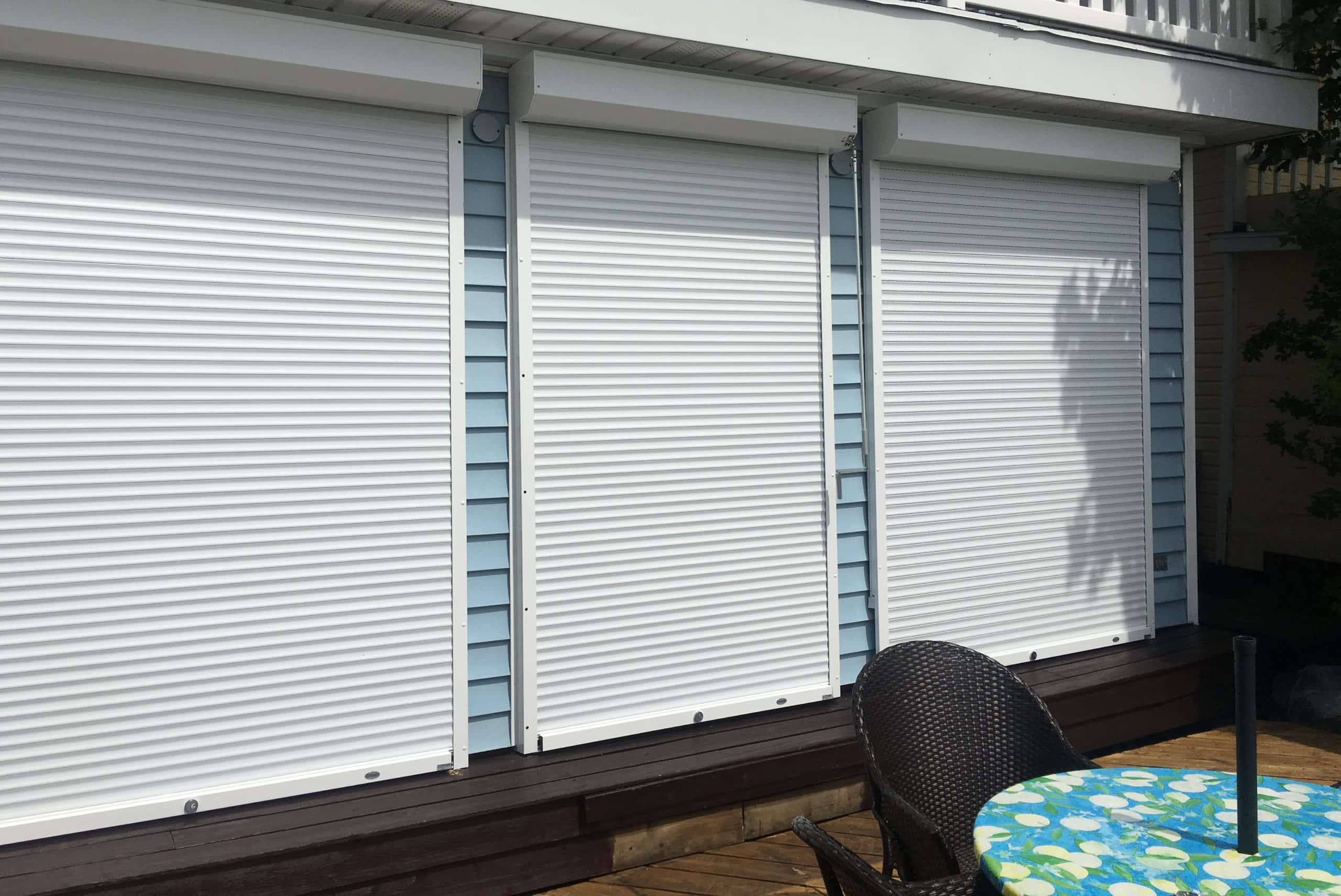 Aluminum roll shutters installed on commercial storefront windows