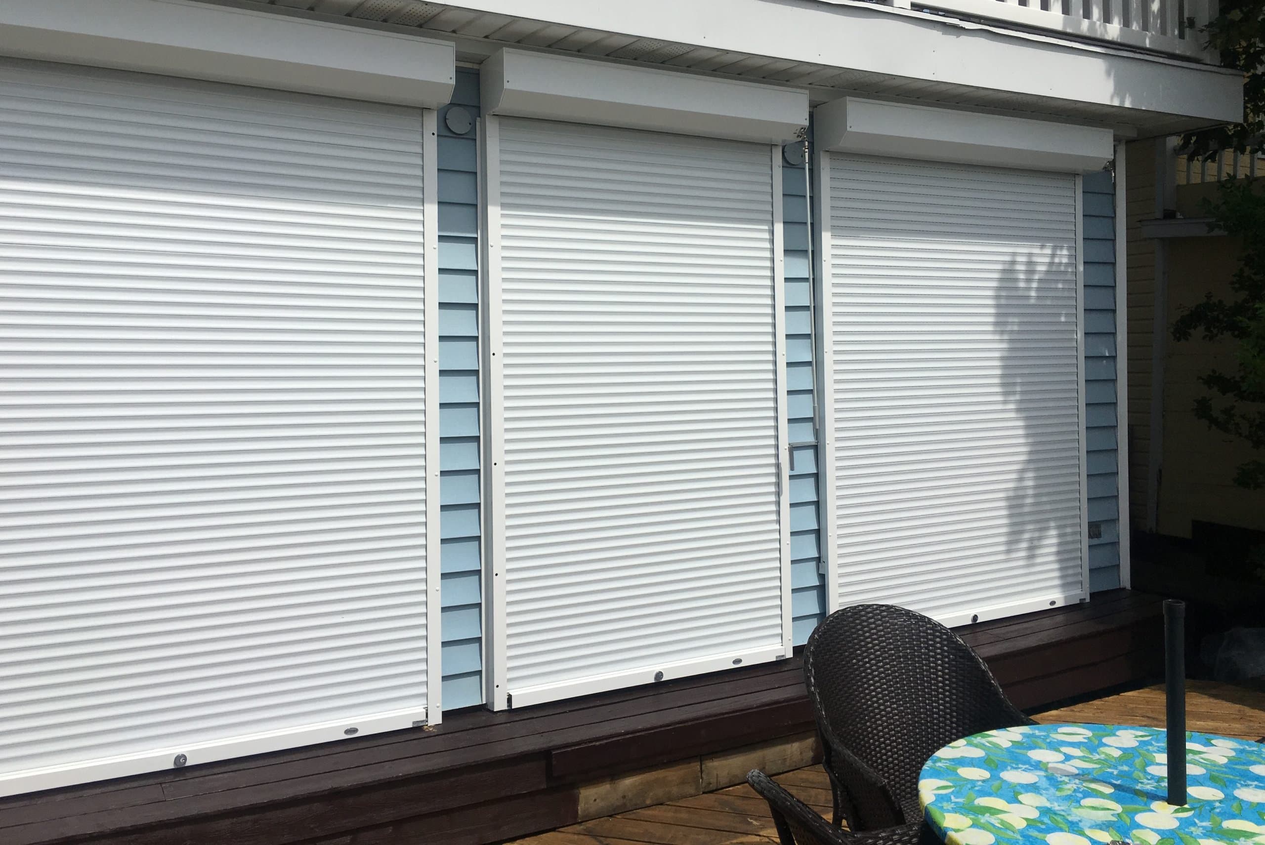 Aluminum roll shutters installed on commercial storefront windows